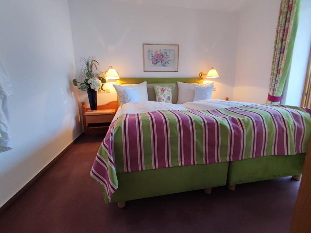 Postel nebo postele na pokoji v ubytování Aparthotel Fackler