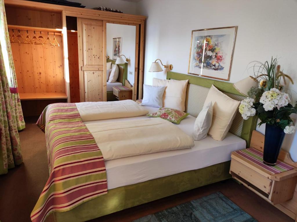 Postel nebo postele na pokoji v ubytování Aparthotel Fackler