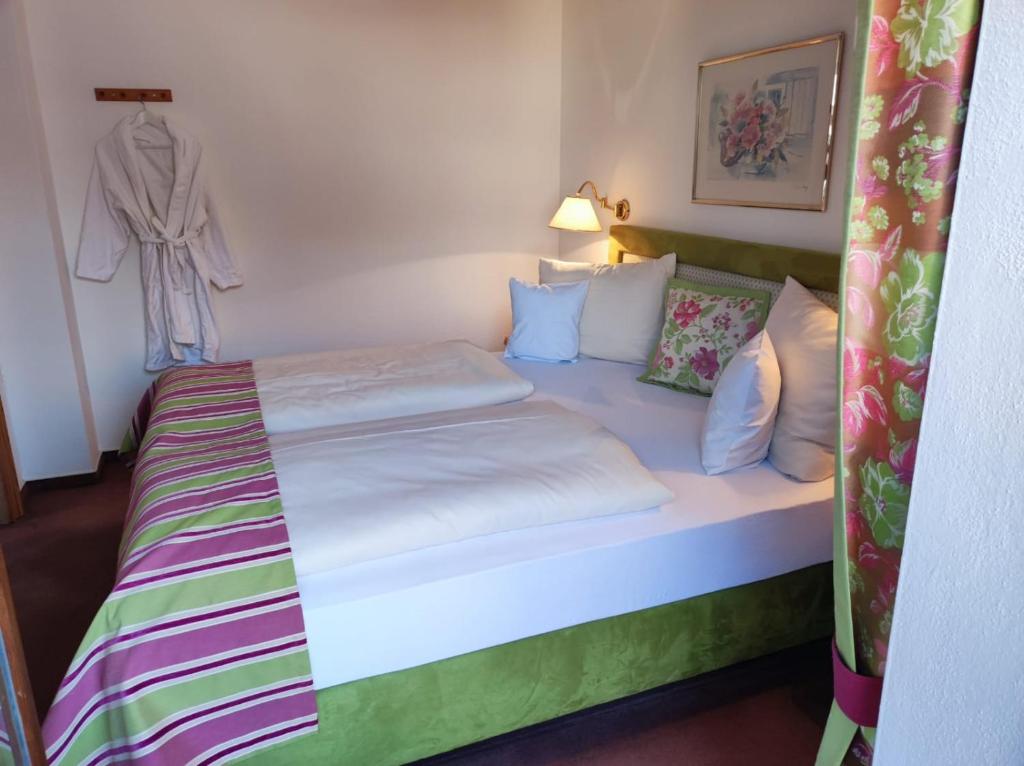 Postel nebo postele na pokoji v ubytování Aparthotel Fackler