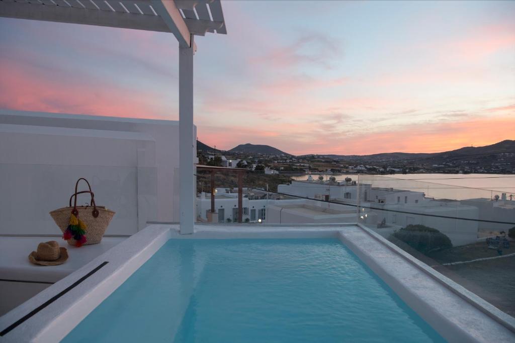 a swimming pool on the roof of a house at Ammos Luxury Rooms & Home in Naousa