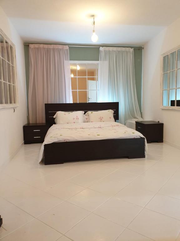 Postel nebo postele na pokoji v ubytování HOUSE SUITES DOMAINE