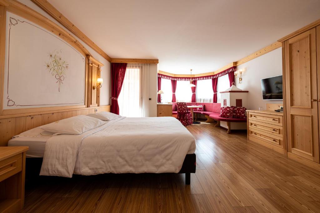 Postel nebo postele na pokoji v ubytování Hotel Cristina