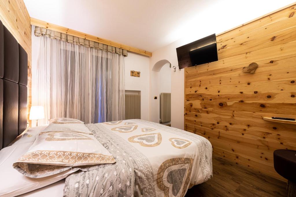 Postel nebo postele na pokoji v ubytování Hotel Cristina