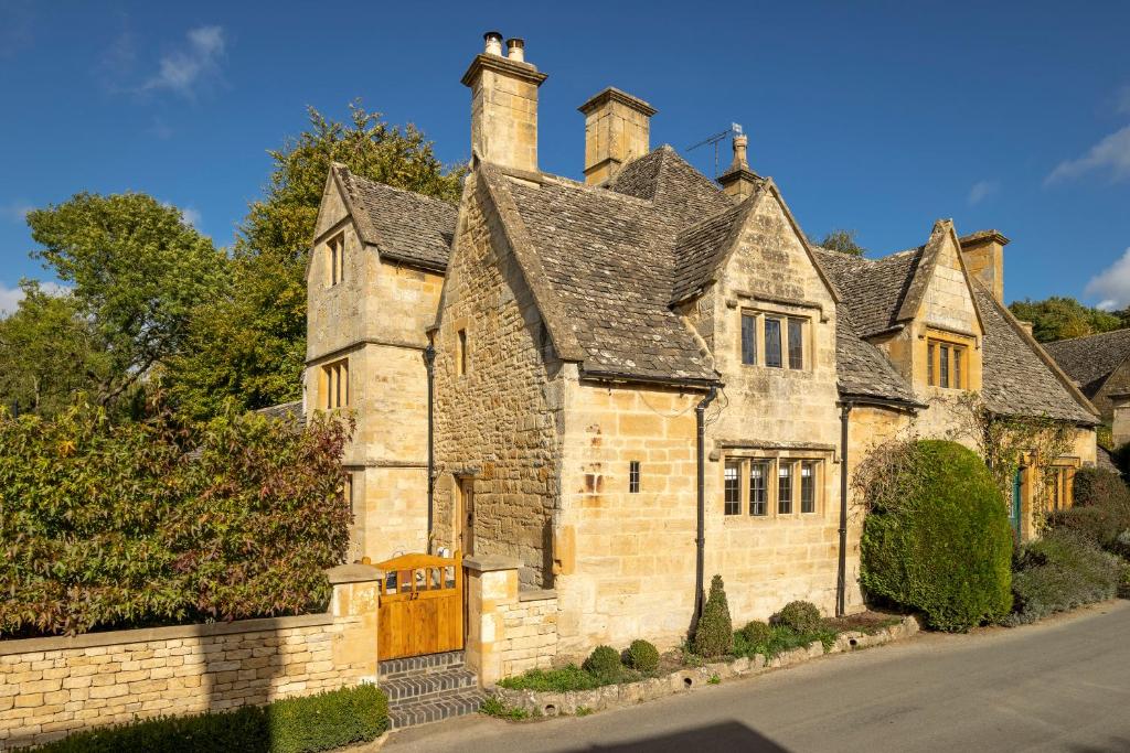an old stone house with a turret at Stone Cottage in Stanton