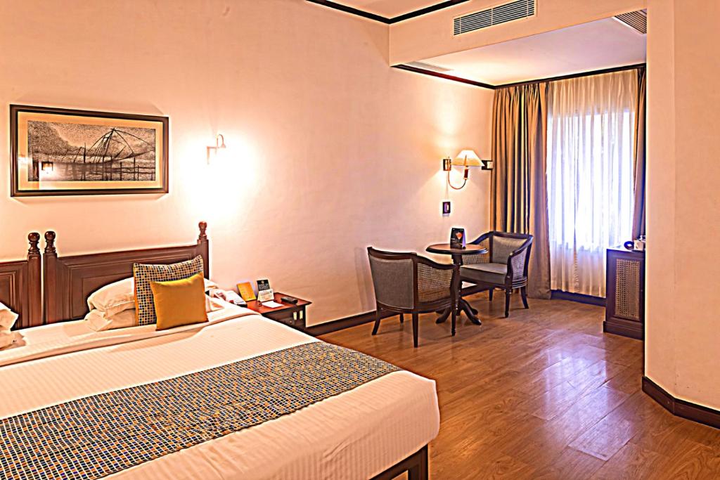Postel nebo postele na pokoji v ubytování Casino Hotel - CGH Earth, Cochin