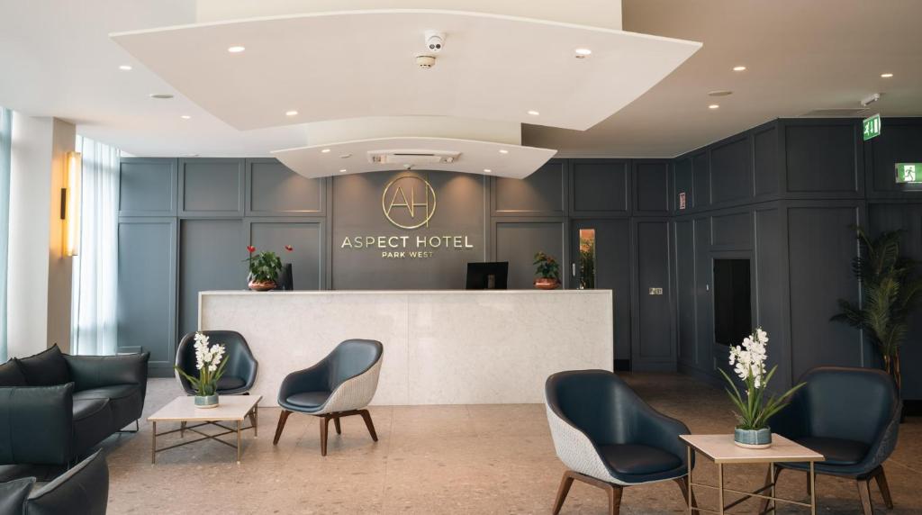 a lobby with chairs and a reception desk at Aspect Hotel Park West in Clondalkin 
