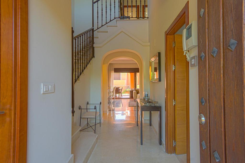 a hallway of a home with a staircase at Townhouse Azata Golf in Estepona