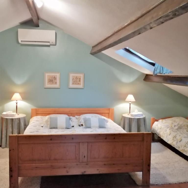 Postel nebo postele na pokoji v ubytování Chambres Rozies Dunes