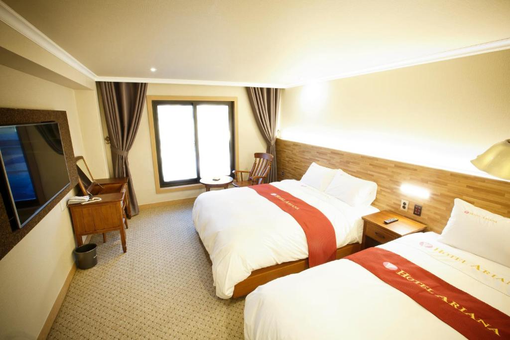 Postel nebo postele na pokoji v ubytování Ariana Hotel