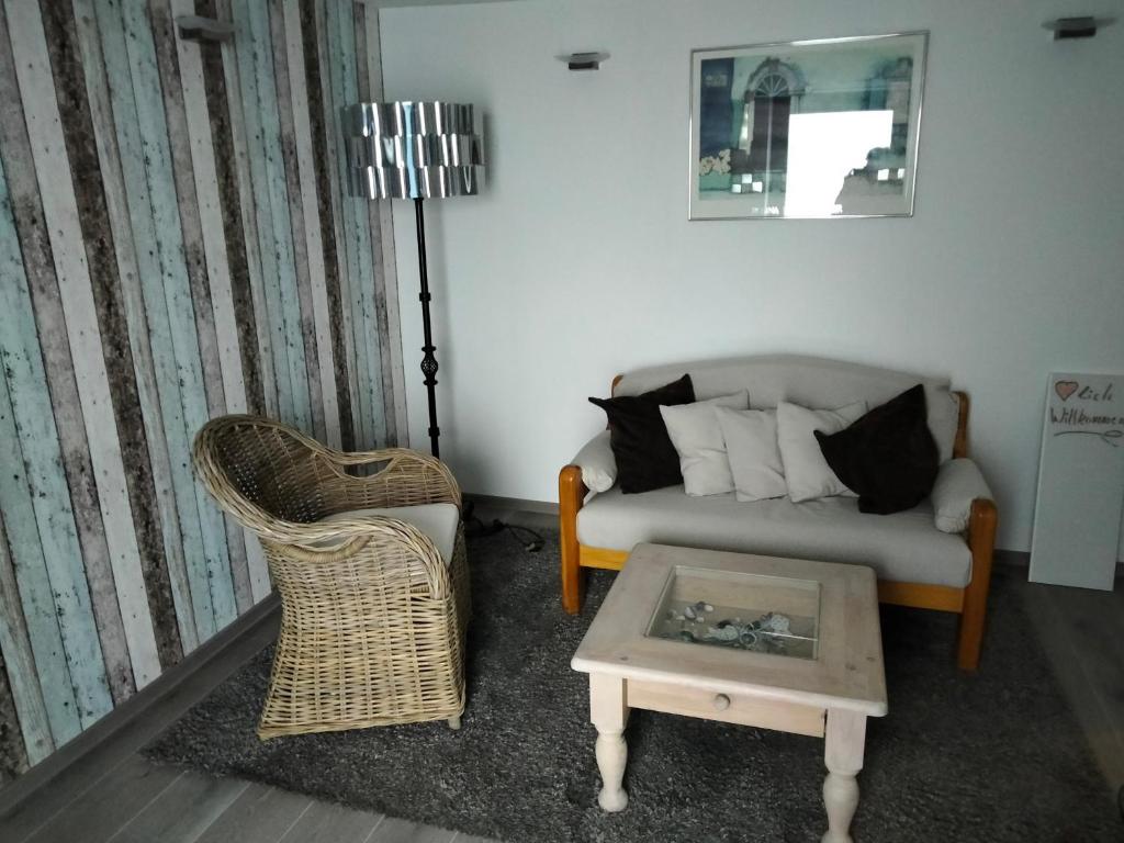 a living room with a couch and a coffee table at Ferienwohnung CoCo in Haltern