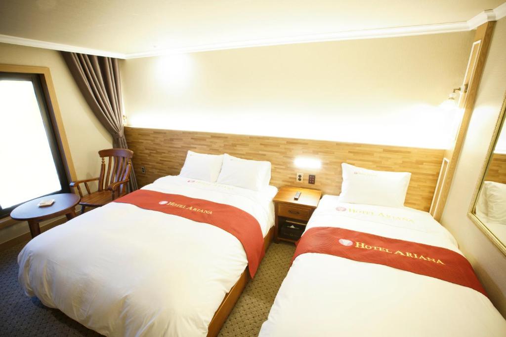 Postel nebo postele na pokoji v ubytování Ariana Hotel