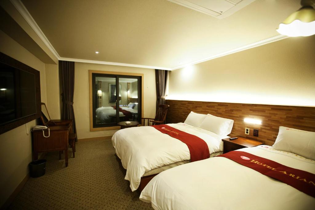 Postel nebo postele na pokoji v ubytování Ariana Hotel