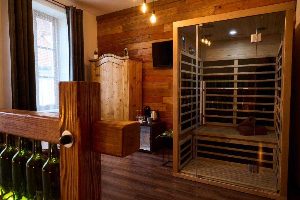 a room with a wine cellar with wine bottles at Dům u lázní in Znojmo