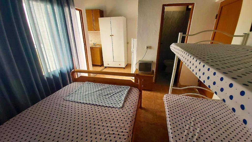 Second Room of Cozy Beachside Haven - Panoramic Radhime Retreat with Balcony Dining - Image 6