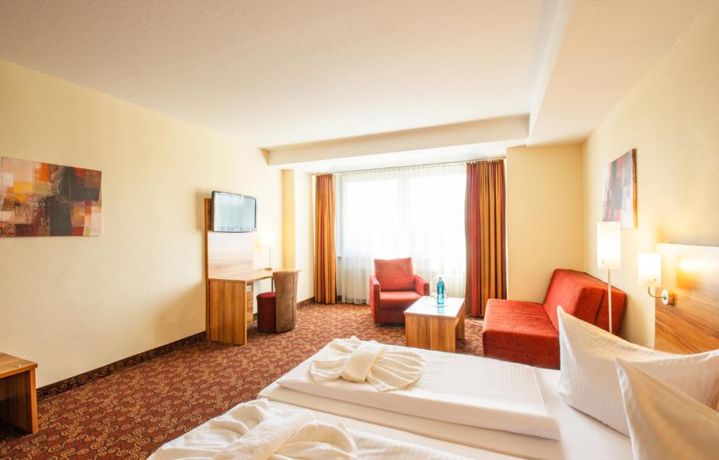 Ένα ή περισσότερα κρεβάτια σε δωμάτιο στο Ferien Hotel Rennsteigblick