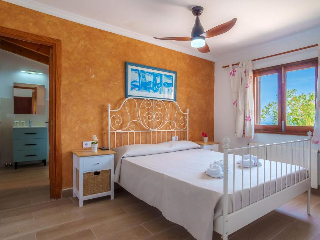 Кровать или кровати в номере Villa Cala Torta Na Moli by Interhome
