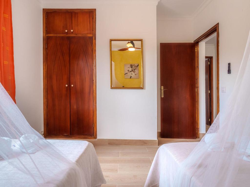 Кровать или кровати в номере Villa Cala Torta Na Moli by Interhome
