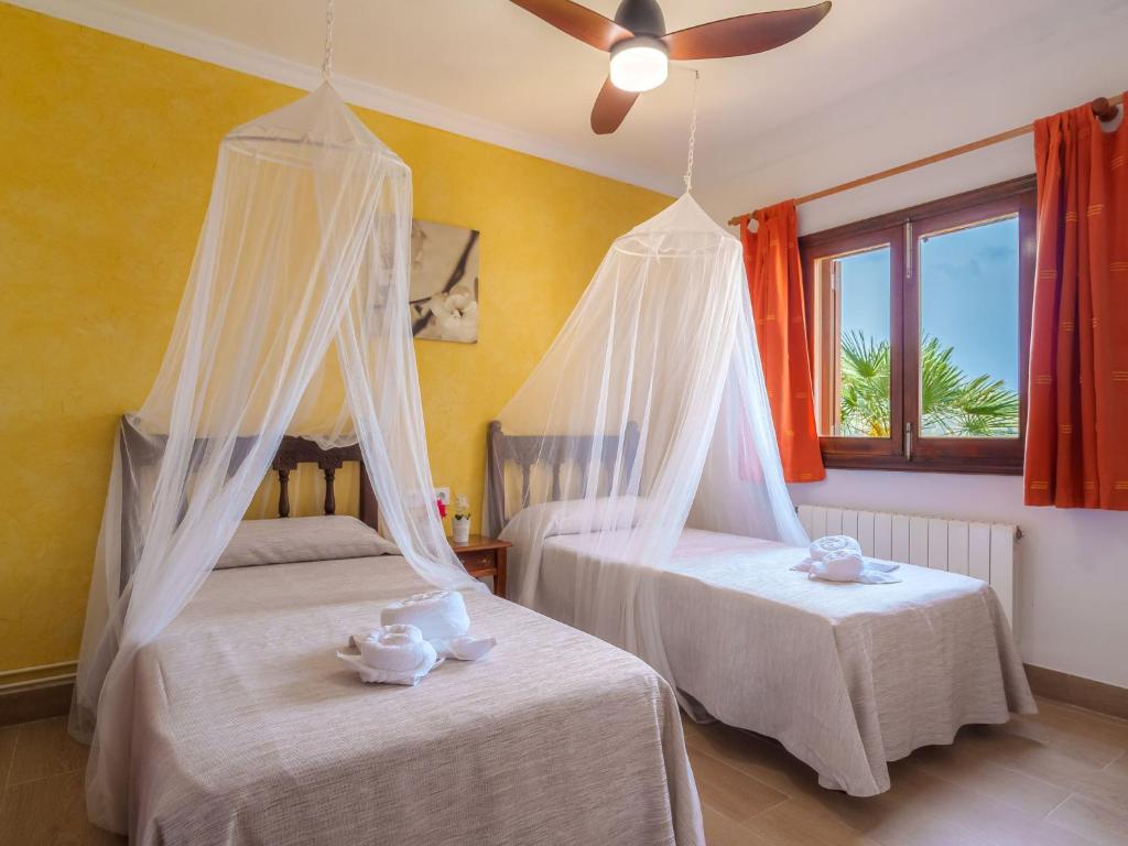 Кровать или кровати в номере Villa Cala Torta Na Moli by Interhome