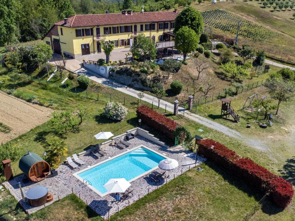 an aerial view of a house with a swimming pool at Holiday Home Agriturismo I Tre Tigli by Interhome in Serravalle dʼAsti