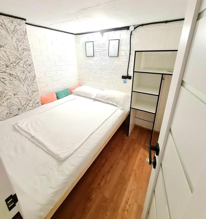 a small room with a bed in it at Hostel Caps Home in Astana