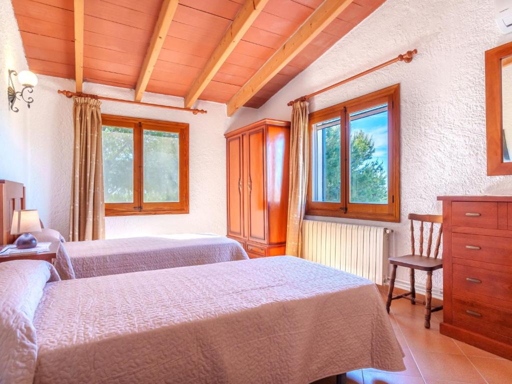 Postel nebo postele na pokoji v ubytování Villa Hort des Xilindro by Interhome