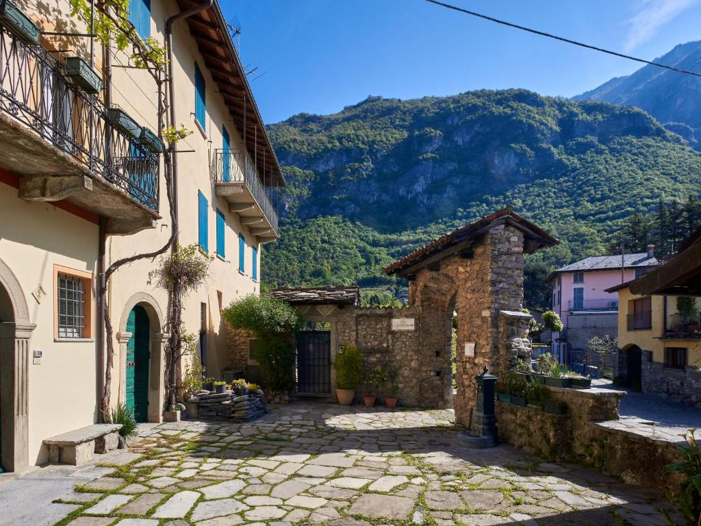 an alley in a town with a mountain in the background at Holiday Home La Cascina by Interhome in Lierna