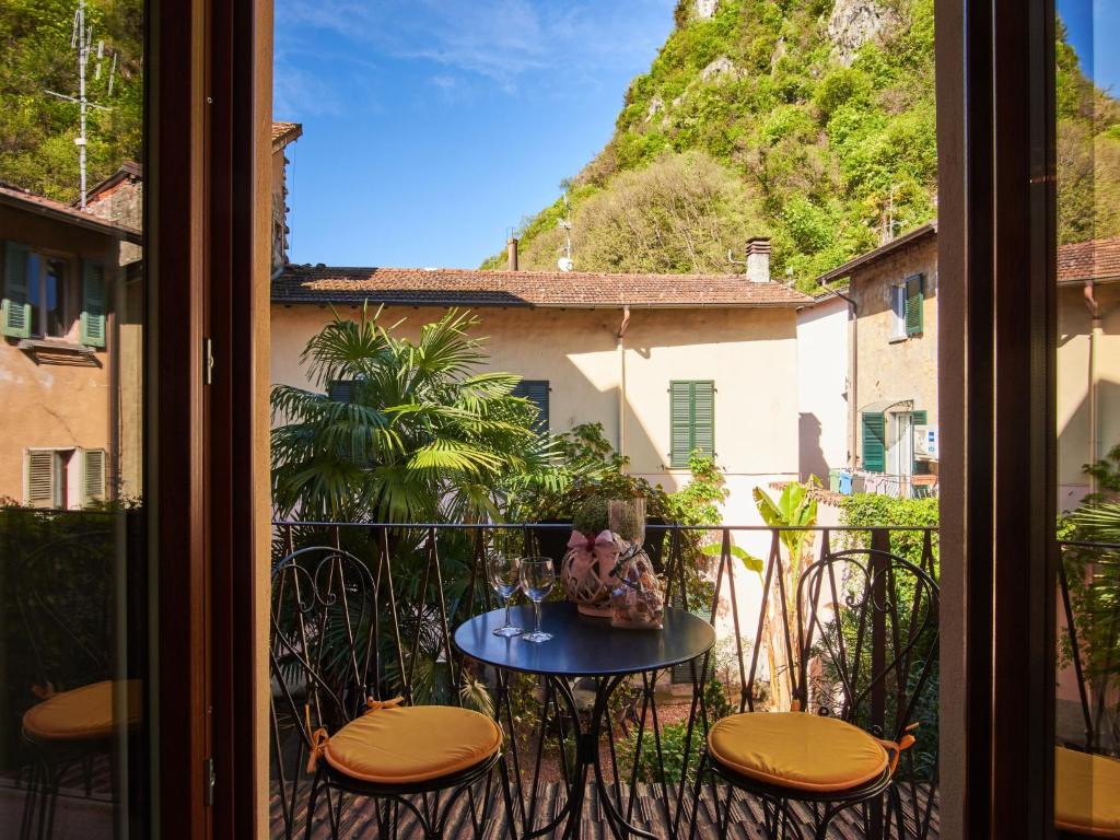 a view of a balcony with a table and chairs at Apartment Cris House by Interhome in Porlezza