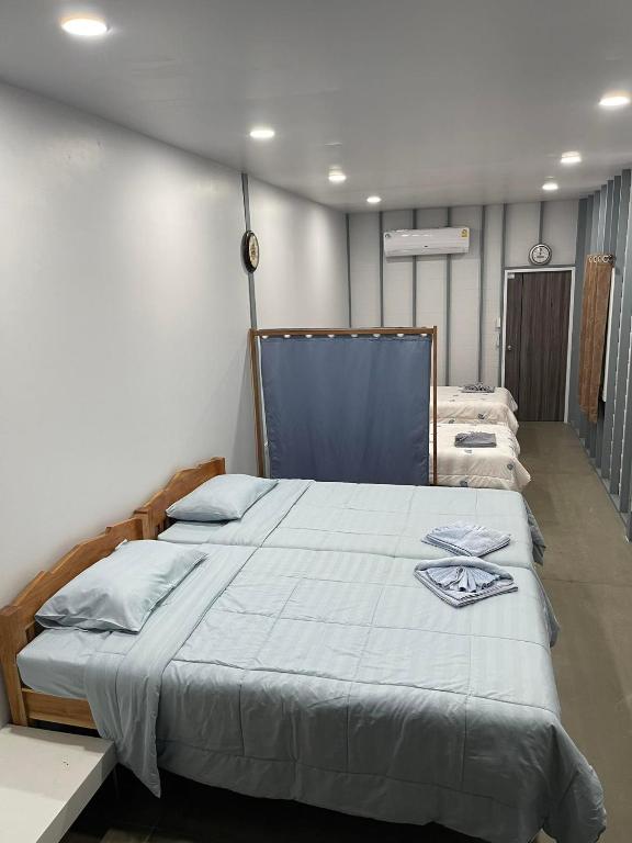 Postel nebo postele na pokoji v ubytování Hunny Home