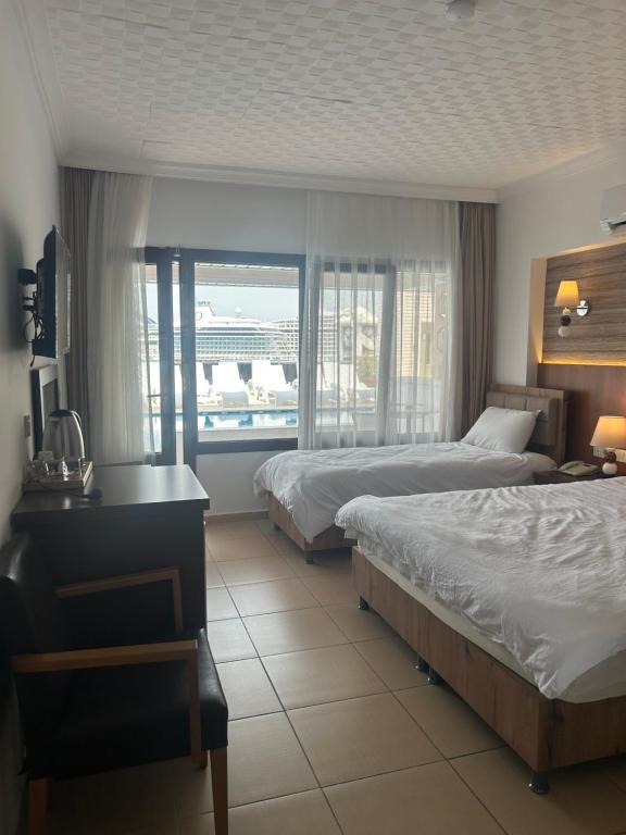 Postel nebo postele na pokoji v ubytování Hotel Stella