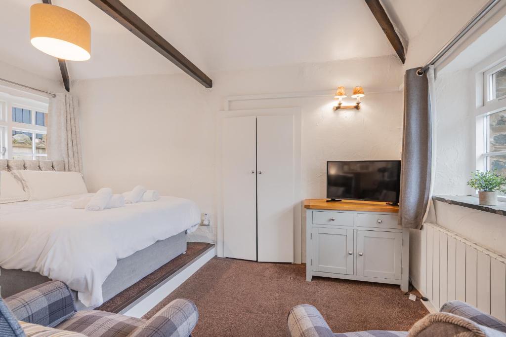 Ένα ή περισσότερα κρεβάτια σε δωμάτιο στο Cottage 5 mews Studio