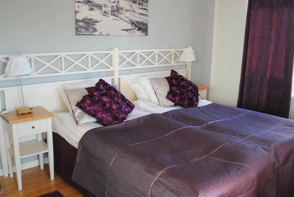 Postel nebo postele na pokoji v ubytování Hotell Nostalgi