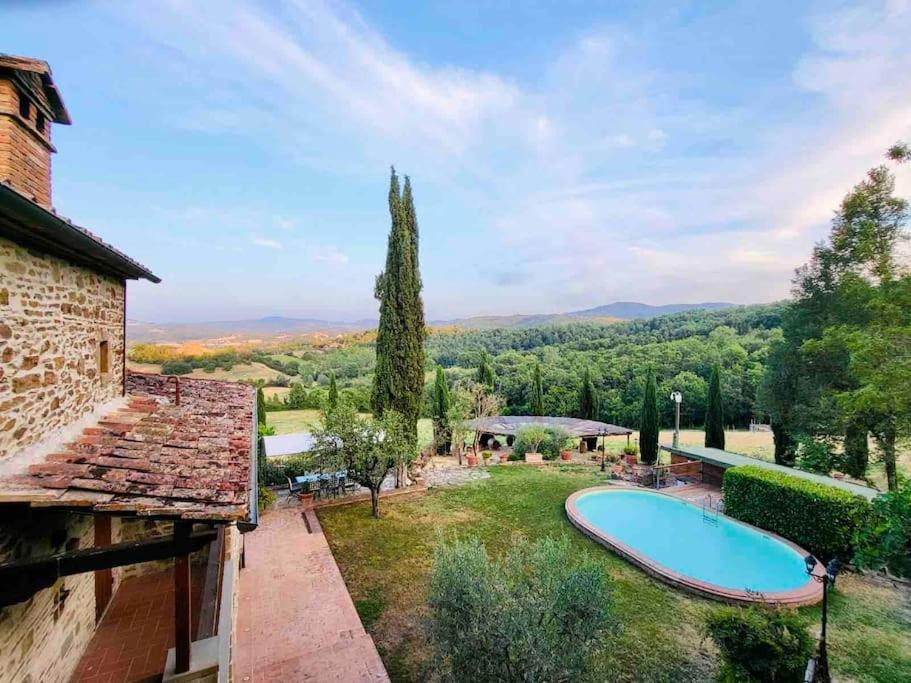 an estate with a swimming pool in a garden at Tuscan dream, lux 2-bed apartment balcony and pool in Anghiari