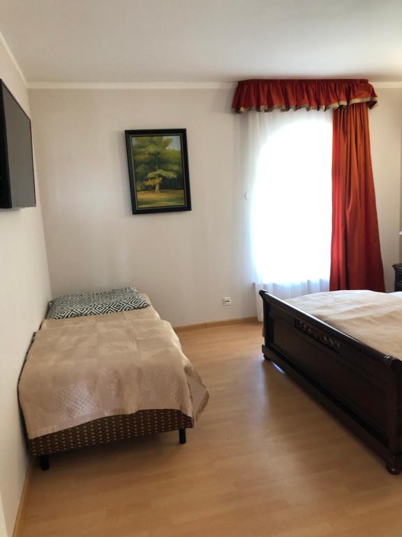 Postel nebo postele na pokoji v ubytování Willa Wicko - Międzyzdroje - apartamenty z aneksem - widok na Zalew Szczeciński