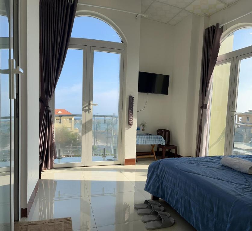 Giường trong phòng chung tại Homestay Hoài Tâm Phan Thiết