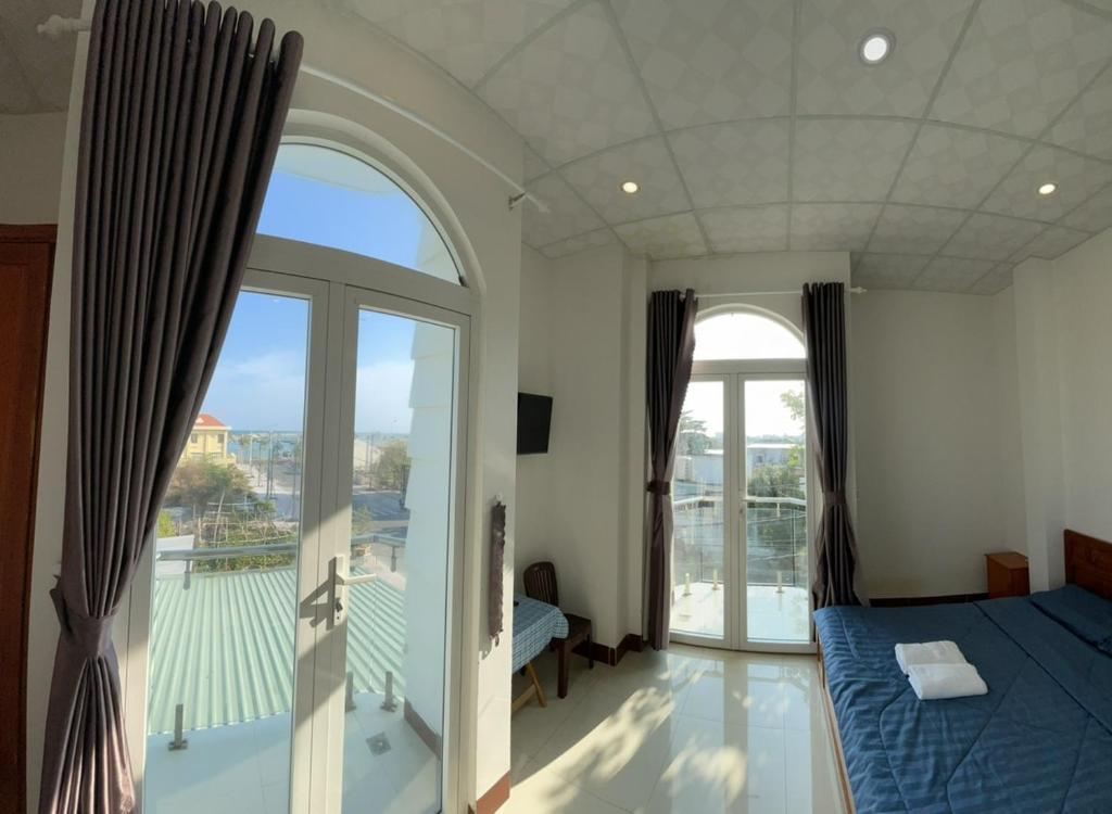 Giường trong phòng chung tại Homestay Hoài Tâm Phan Thiết