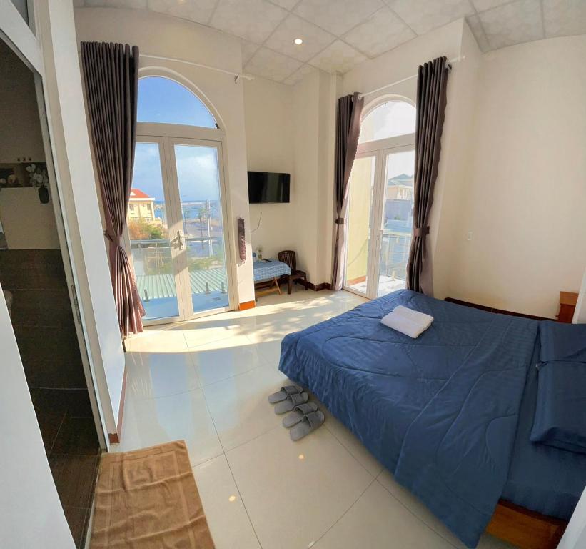 Giường trong phòng chung tại Homestay Hoài Tâm Phan Thiết