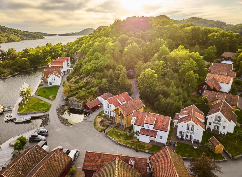 an aerial view of a town with a river and houses at Farsund Resort in Farsund