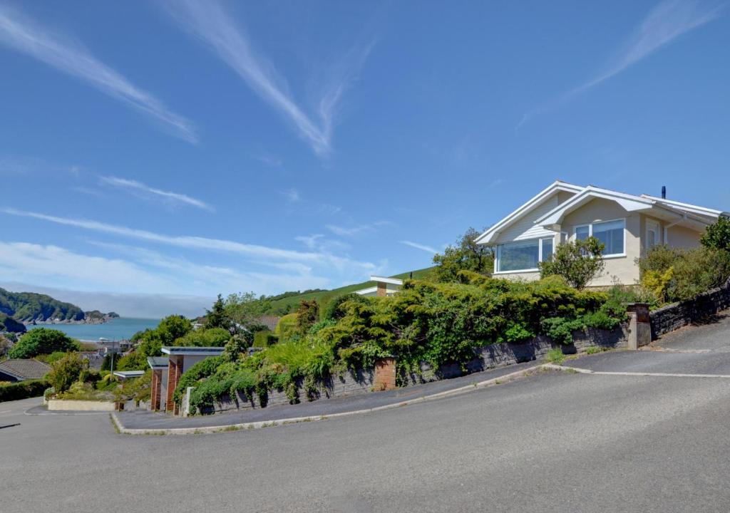 a house on the side of a road at Bay View Bungalow in Combe Martin