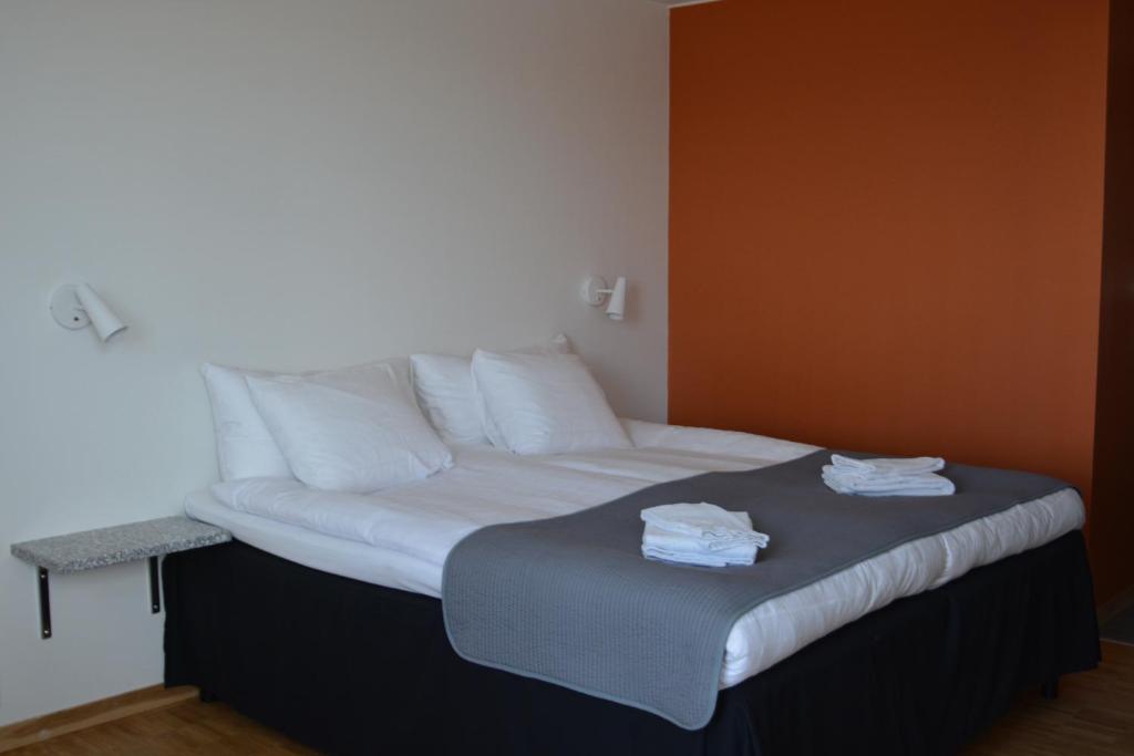 Postel nebo postele na pokoji v ubytování Forskarhotellet