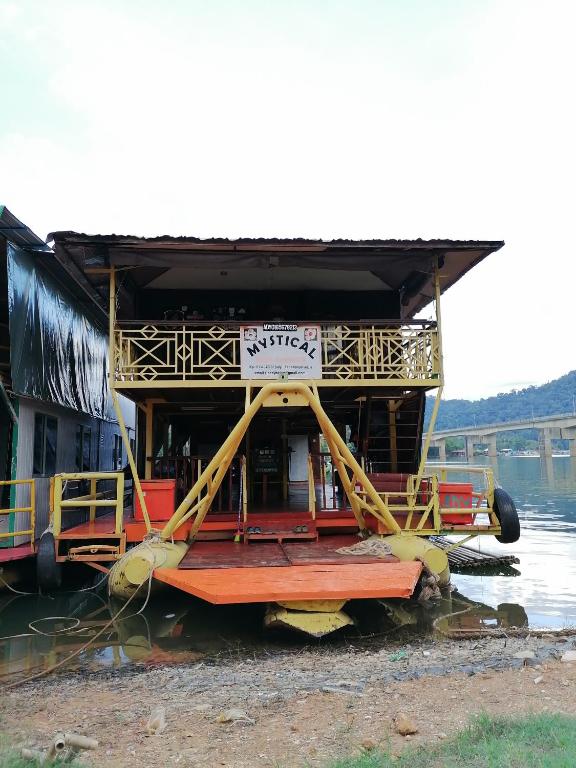 a boat that is sitting in the water at Royal Belum Mystical in Gerik