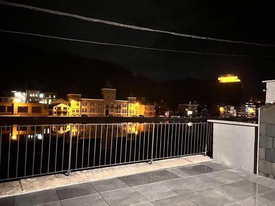 a view of a city at night at Le Franchet in Dinant