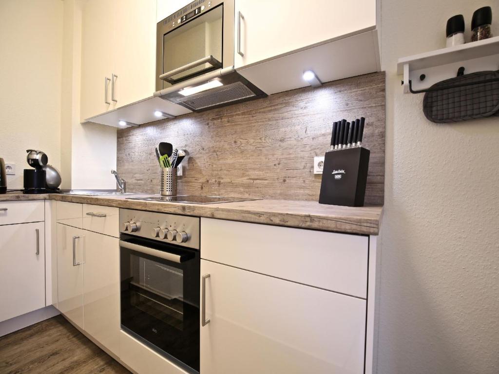 Kuchyň nebo kuchyňský kout v ubytování Strandvilla Marina 18 - Balkon mit Meerblick