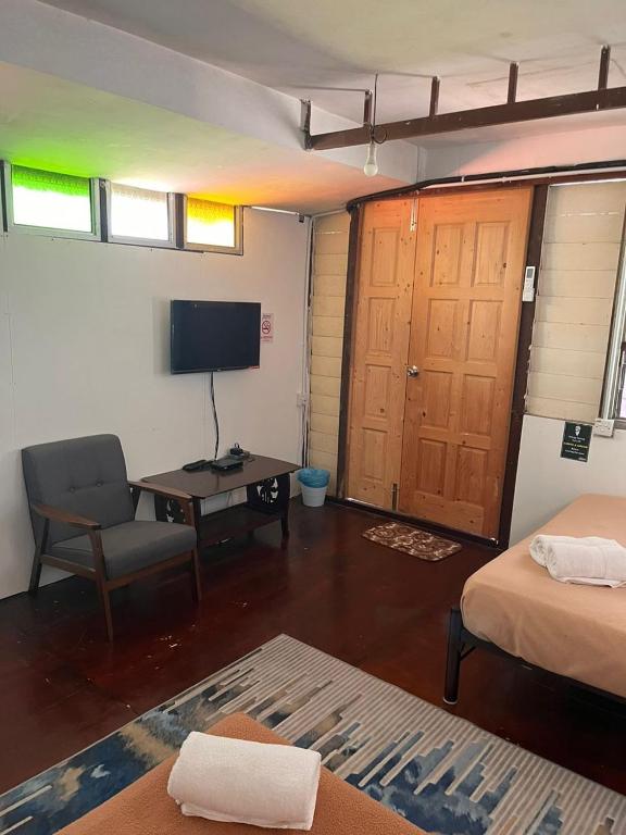 Postel nebo postele na pokoji v ubytování MyDusun Chalet, Taiping, Perak, Malaysia