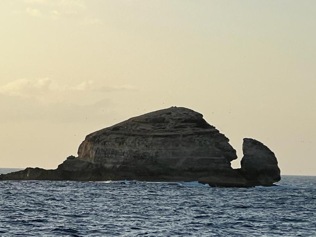 a large rock in the middle of the ocean at Yeux D&#39;azur in Le Souffleur
