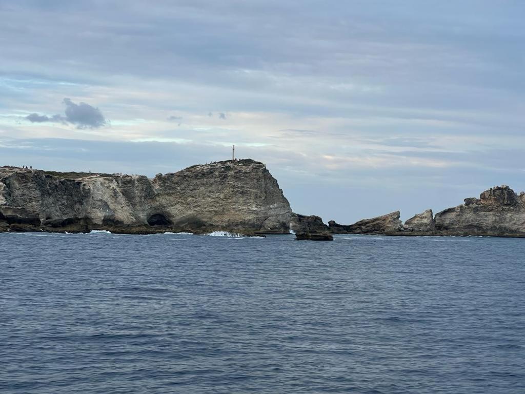 a large body of water with a rocky island at Yeux D&#39;azur in Le Souffleur