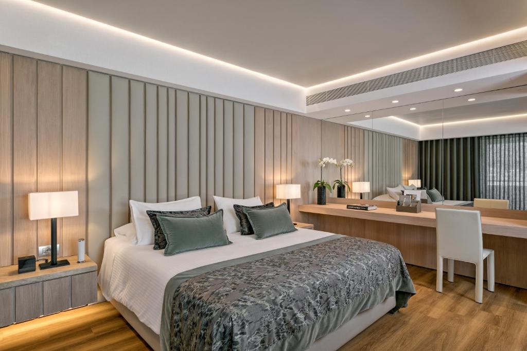 Postel nebo postele na pokoji v ubytování Divani Palace Acropolis