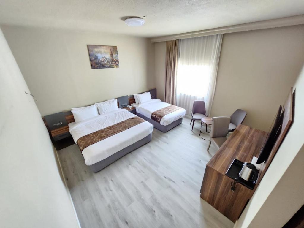 Postel nebo postele na pokoji v ubytování The Saj Hotel
