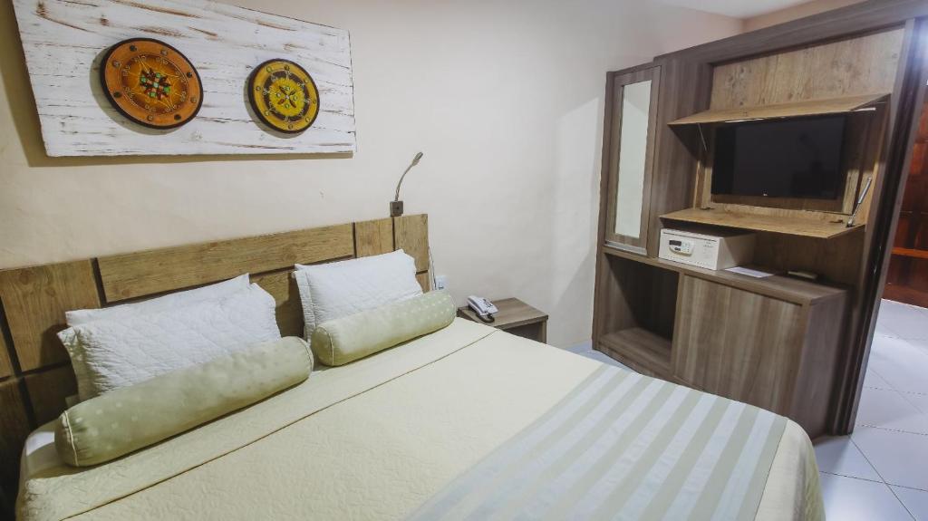 Postel nebo postele na pokoji v ubytování Pousada Safira do Morro