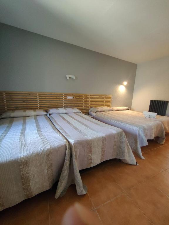 Postel nebo postele na pokoji v ubytování Hotel Acebo Plaza Mayor