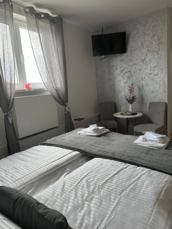 Letto o letti in una camera di San Lux Dunavska
